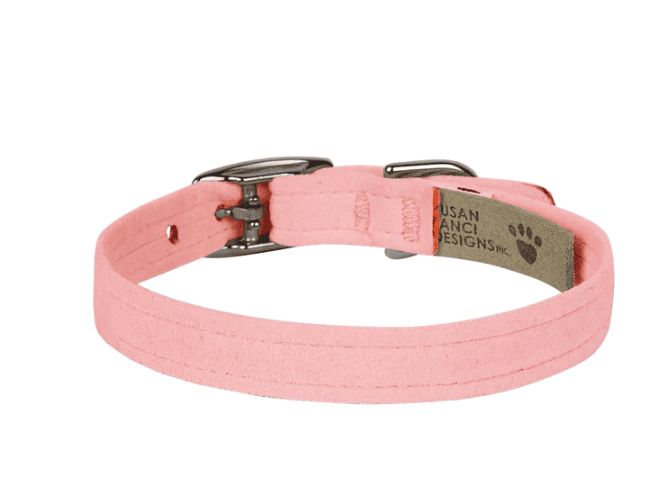 A dog collar in soft pink color with metal buckle and adjustable strap, ideal for small to medium-sized pets, featuring a stylish and comfortable design for everyday wear.